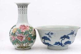 A Japanese blue and white bowl and a Chinese famille rose vase: the bowl with flared rim and