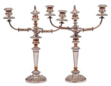 A pair of early 19th Century Sheffield Plate twin branch candelabra,