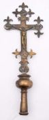 A 17th Century-style cast brass processional crucifix: the cross with fleur-d-lys terminals and
