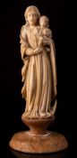 An Indo-Portuguese carved ivory group of the Virgin and Child: 18th/19th Century, 13cm.