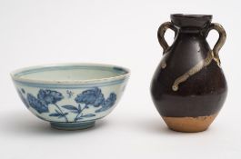 A Chinese blue and white bowl and a two-handled vase: the first painted with flowering stems,