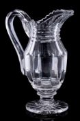 A mid 19th century heavy cut-glass ewer: with pillar cut body and start cut foot, circa 1840, 27cm.