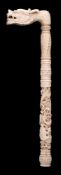 A late 19th century Cantonese carved ivory parasol handle: in the form of a dragon's head,