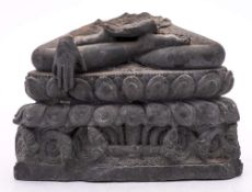 An Indian carved grey schist fragment: of the lower section of a seated Buddha with hands in