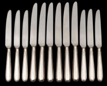 A set of twelve Elizabeth II silver handled table knives and twelve silver handled dessert knives,