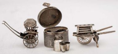 A Chinese silver miniature model of a rickshaw, maker Wang Hing & Co , Hong Kong: 6cm long,