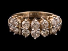 A diamond mounted two-row half-hoop ring: with round brilliant-cut diamonds estimated to weigh a