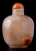 A Chinese agate snuff bottle: of mottled grey and russet colour carved with a single lingzhi spray,