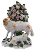 A Derby model of a ram and lamb: the ram standing within bocage support, a recumbent lamb below,