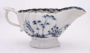 A Plymouth blue and white sauceboat: of fluted form with scroll handle and thumbrest,