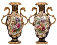A pair of mid 19th century English porcelain vases: with ram's head scroll handles and moulded with