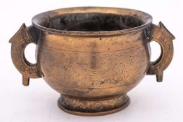 A Chinese inlaid bronze censer: with flared rim and stylised mythical beast handles,