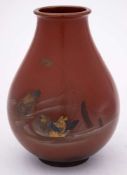 A Japanese bronze vase: of ovoid form, decorated with mandarin ducks amongst reeds, signed, 19cm.