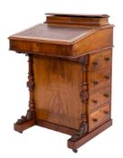 A Victorian walnut and inlaid Davenport:, bordered with lines,