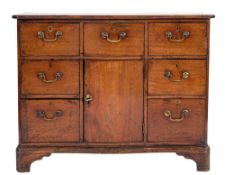 A George III mahogany serpentine fronted side cabinet:,