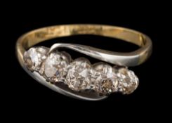 A diamond mounted five-stone cross-over ring: set with round old brilliant-cut diamonds estimated