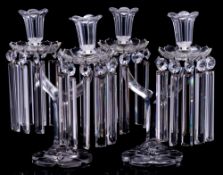 A pair of twin branch cut glass lustres: with hexagonal sockets set on petal shaped drip pans hung
