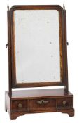 An 18th Century walnut and partly gilt swing frame platform toilet mirror:,