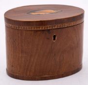 An 18th Century mahogany and inlaid oval tea caddy: the hinged lid with inlaid conch shell