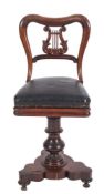 A Harpist's Victorian carved rosewood revolving chair:,