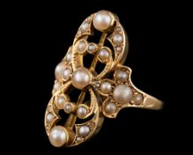 An early 20th Century gold and seed-pearl mounted 'along-the-finger' cluster ring: of openwork