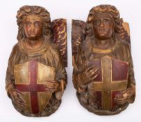 A pair of Victorian carved wood and polychrome decorated corbels: in the form of angels,