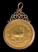 A 1oz Krugerrand dated 1974 mounted as a pendant: within a 9ct gold frame,