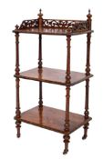 A Victorian walnut and inlaid three tier whatnot:,