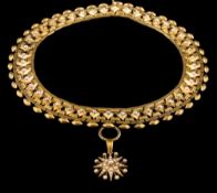 An Etruscan-style seed pearl mounted collar necklace: each pierced panel with a single seed pearl,