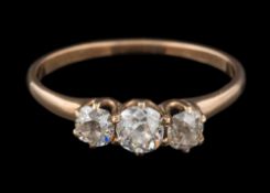 A diamond mounted three-stone ring: set with round old brilliant-cut diamonds estimated to weigh a