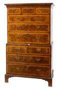 An early 18th Century walnut and cross and feather banded tallboy:,
