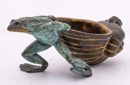 An Austrian patinated and gilt bronze ashtray: in the form of a toad pulling a large upturned shell,