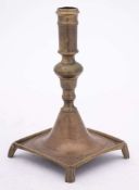 An 18th Century Spanish brass candlestick: with plain cylindrical nozzle on a bulbous knopped stem,