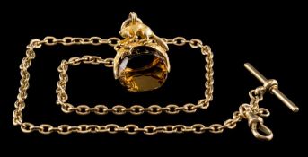 A 19th Century gold and citrine mounted swivel seal with fox motif: 30mm high with attached 18ct