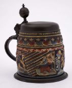 A German pewter mounted stoneware 'Hunting' stein: decorated in polychrome enamels on applied