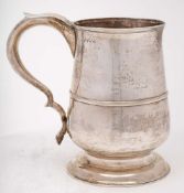 A George III silver tankard, maker's marks worn Dorothy Langlands, Newcastle 1806: initialled,