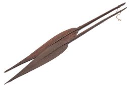 Two Papua New Guinea paddles: of traditional form with leaf blades,