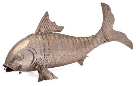 A European white metal articulated catfish: with incised scale decoration and hinged fins, 33cm.