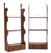 Two similar George III mahogany three tier hanging bookcases:, having shaped uprights,
