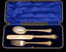 An Edward VII silver gilt three-piece Albany pattern christening set, maker Joseph Rodgers & Sons,