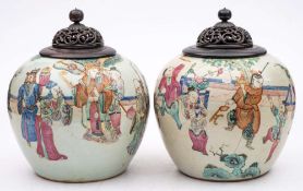 A pair of Chinese famille rose ginger jars: painted with a terrace court scene with the Immortal