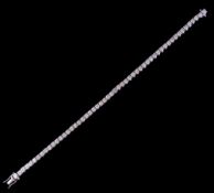 An 18ct white gold and diamond line tennis bracelet: with 53 circular brilliant-cut diamonds each