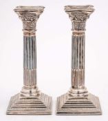 A pair of Elizabeth II silver Corinthian column candlesticks, maker A Taite & Sons Ltd, London,