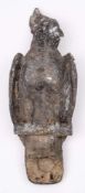 A large 19th Century cast lead finial in the form of a parrot: with folded wings and raised crest,