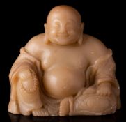 A Chinese soapstone figure of Budai: wearing flowing robes,