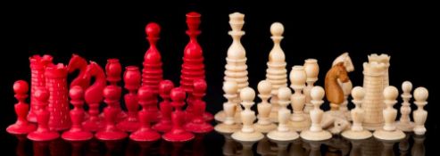 A 19th century ivory chess set of Calvert type: one side stained red the other left natural,