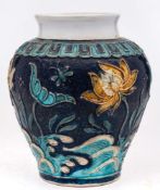 A Chinese Fahua stoneware baluster jar: decorated with insects flying amongst lotus flowers and