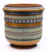 A very large Doulton Lambeth stoneware jardiniere: of footed cylindrical form applied with multiple