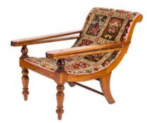 A 19th Century mahogany plantation armchair:, with later carpet upholstery,