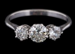A diamond three-stone ring: set with round old brilliant-cut diamonds,